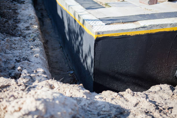 Professional Basement Waterproofing technician working in Lewisville, WA